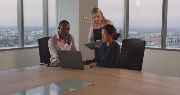 Professional businesspeople working together in modern office in slow motion