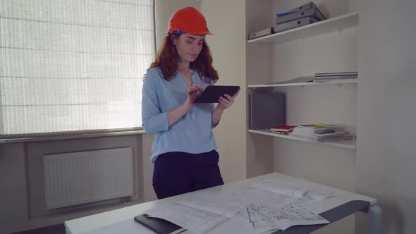 Woman Architect with Blueprint Architectural Plan