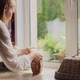 Adult Woman Looking Out the Window - VideoHive Item for Sale