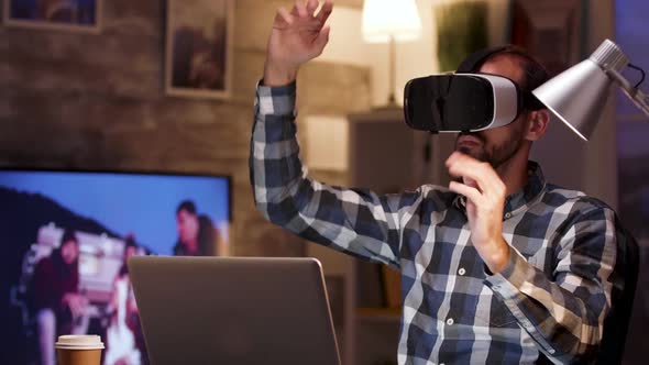 Bearded Businessman Using Virtual Reality Goggles in Home Office