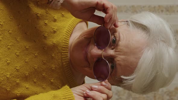 Lovely Old Caucasian Woman Adjusting Sunglasses at Home Medium Closeup Indoor Senior People Concept