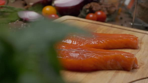 Two Slices of Salmon on the Cutting Board