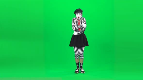 Mime Acting Like Cold, Then Hot. Chroma Key