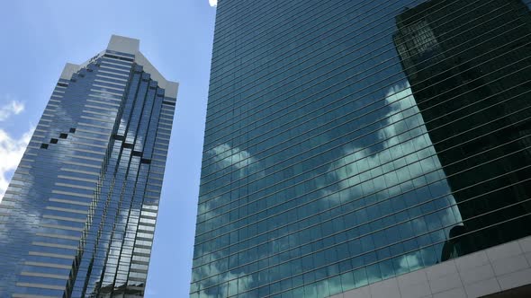 Upshot clouds on tall building glass delay