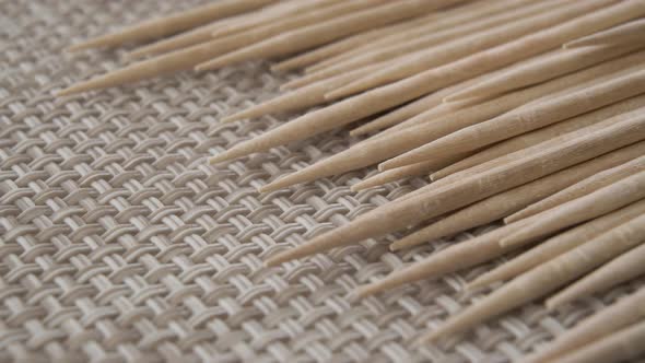 Sharp wooden toothpicks on a kitchen plastic mat