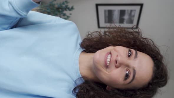 Happy Pretty Hispanic Gen z Teen Girl Talking To Camera Shooting Vertical Video