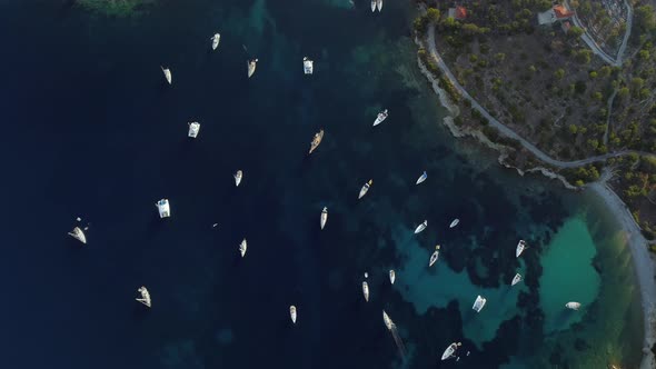 Aerial view of group of boats anchored in the mediterranean sea, Kastos island.