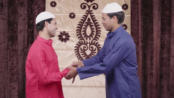 Muslim man congratulating his friend