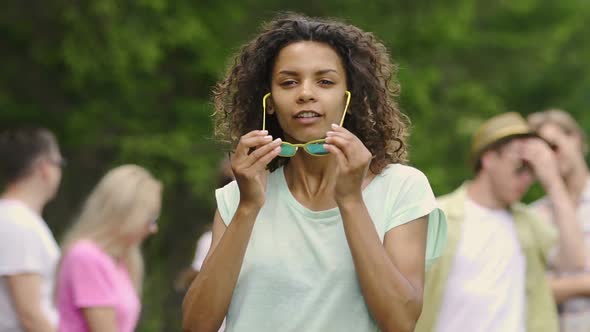 Charming Girl in Sunglasses Posing for Camera, Moving to Music at Dance Audition