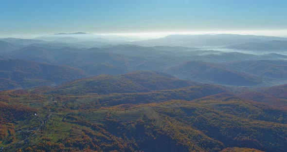 Picturesque Autumn Forest From the Height of the Mountains Landscapes in Scenic Aerial View