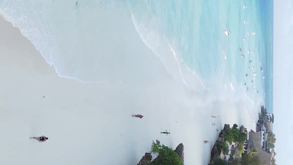 Vertical Video Boats in the Ocean Near the Coast of Zanzibar Tanzania Aerial View