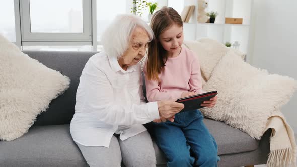 Granddaughter and Grandmother with Tablet