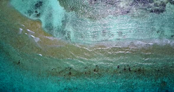 Daytime drone island view of a summer white paradise sand beach and turquoise sea background in vibr