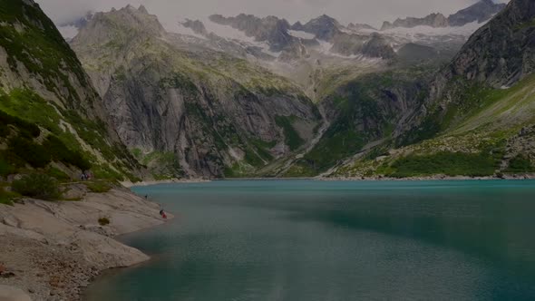 mountain lake in the swiss alps, reservoir in the middle of the mountains
