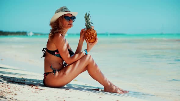 Travel Girl Relaxing On Caribbean Beach. Tanned Woman In Swimsuit Healthy Skin Sunbathing.