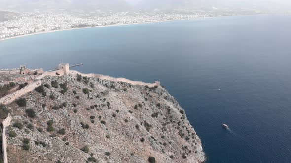 Alanya, Turkey, view of city with tourist area, quay, residential buildings and mountains