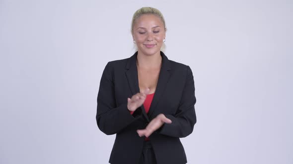 Young Happy Blonde Businesswoman Clapping Hands