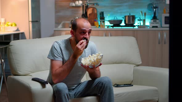 Upset Caucasian Man Watching Sport Match Alone