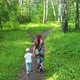 A Young Mother with a Child Walking in the Park - VideoHive Item for Sale