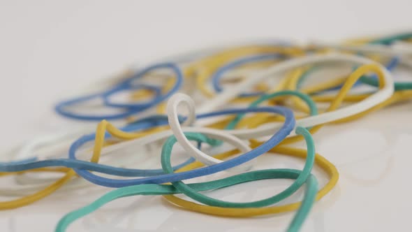 Slow pan on ring shaped rubber bands  close-up 4K footage