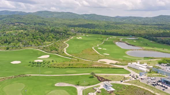 Drone flying over Vistas Golf and Country Club, Santo Domingo in Dominican Republic. Aerial forward