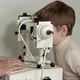 Old Male Doctor Examines Eyes of Boy Through Slit Lamp - VideoHive Item for Sale