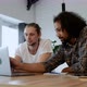 Two Young Freelance Guys Work Remotely At Home on an Online Project, Using a Laptop - VideoHive Item for Sale