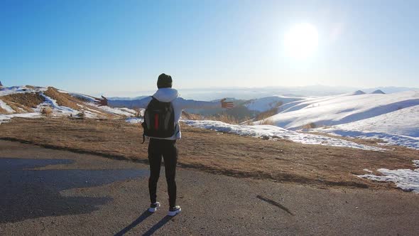 Successful Girl Hiker Open Arms in the Sky After Hiking To Mountain Top Summit Above the Clouds.