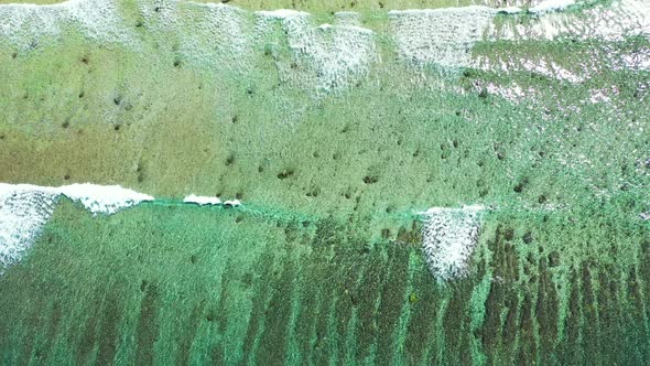 Wide aerial abstract shot of a summer white paradise sand beach and aqua turquoise water background 