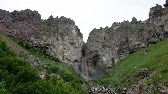 Dirty Waterfall Sultan High in the Mountains Near Elbrus in Summer