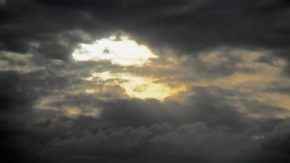 Sunlight Passing Through The Opening in Dark Cloud