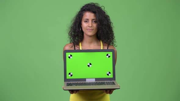 Young Beautiful Hispanic Woman Showing Laptop