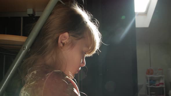 Little Girl Backlight Closeup