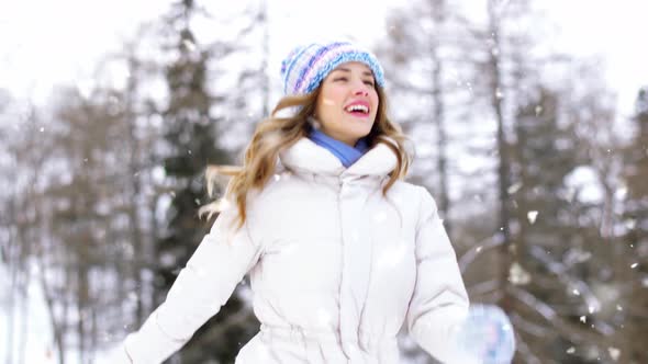 Happy Smiling Woman Outdoors in Winter Forest