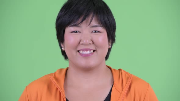 Face of Happy Young Overweight Asian Woman Smiling Ready for Gym