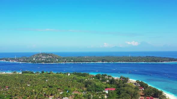 flying over white sand beach tropical sea green forest turquoise water coral reef. aerial panorama