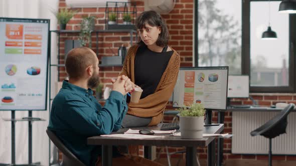 Man and Woman Brainstorming Ideas to Plan Business Project