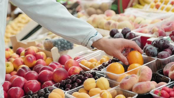 Unrecognizable Man Buying Fresh Fruit