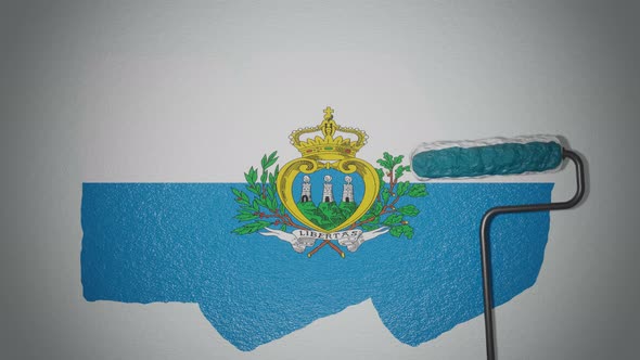 Roller paints the wall in colors of  San Marino flag