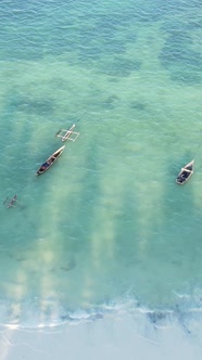 Vertical Video Boats in the Ocean Near the Coast of Zanzibar Tanzania