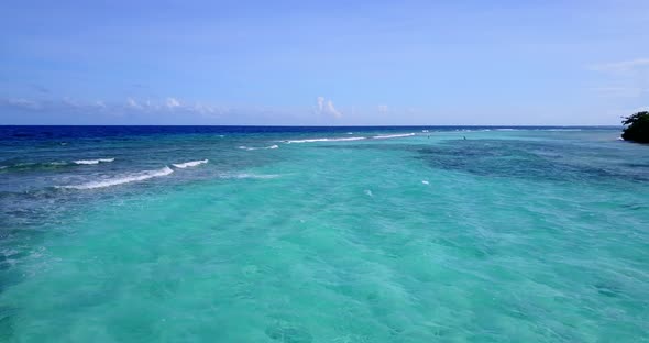 Beautiful aerial island view of a sandy white paradise beach and aqua blue water background in high 