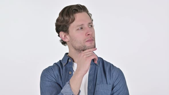 Contemplative Young Man Thinking New Idea on White Background