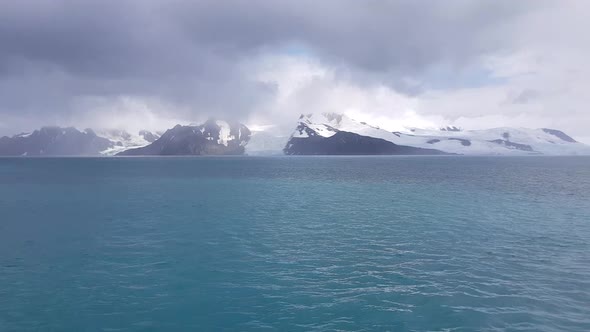 Antarctic Landscape with Icebergs in Foreground