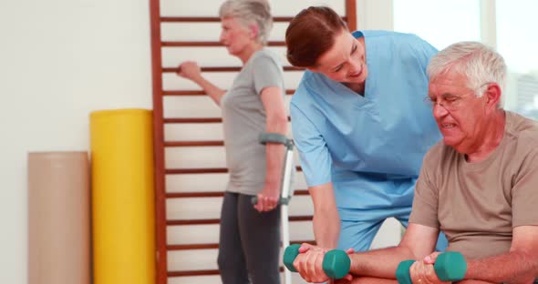 Senior Citizens Exercising with Physiotherapist