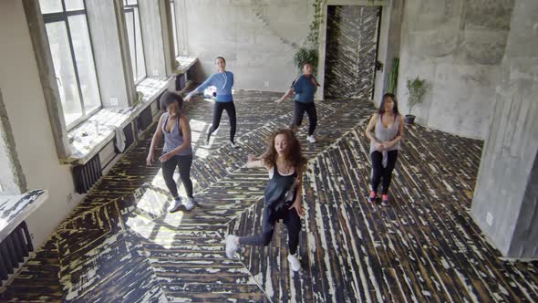 Dance Teacher Showing Moves to Female Group