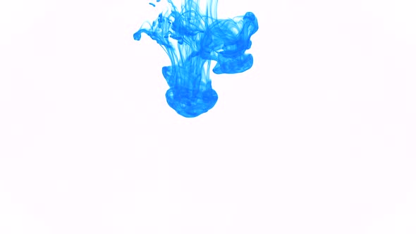 A drop of blue ink falls into the water