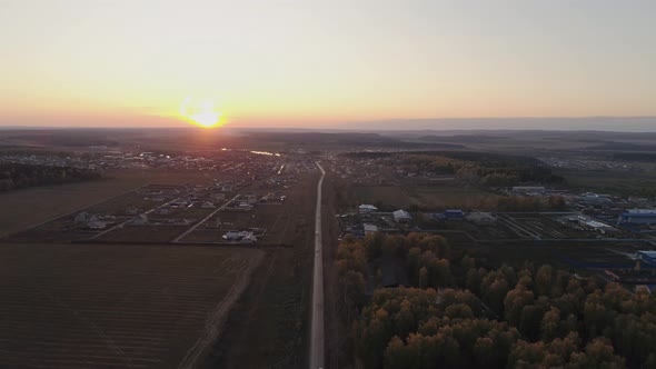 Aerial view of autumn village, evening, sunset 01