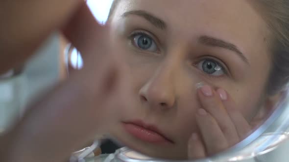 Young Woman Applying Eye Cream, Anti-Age Cosmetic, Skin Care, Rejuvenation