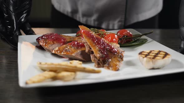 Restaurant Food Concept. Chef Presenting His Food Plate in Kitchen of Restaurant. Close Up. Cooking