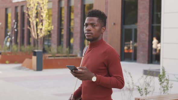 African American Businessman Making Phone Call Outdoors